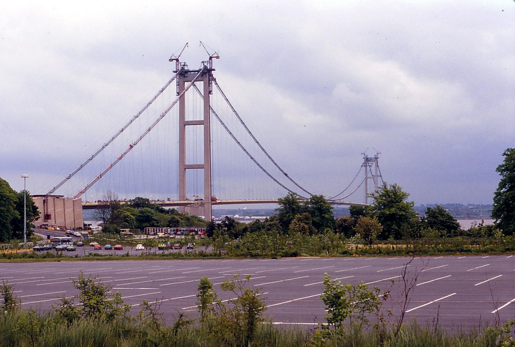 Both towers vertical, neither parallel, forty years apart